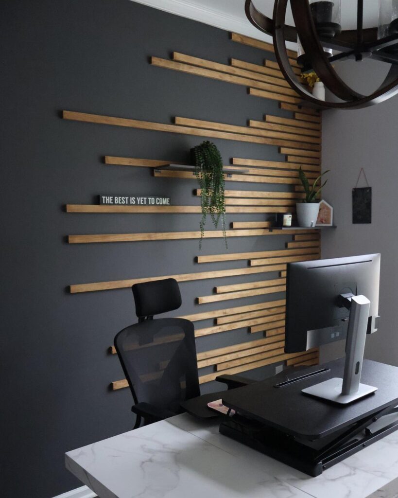 Dark grey accent wall with horizontal wooden slats in a modern home office.