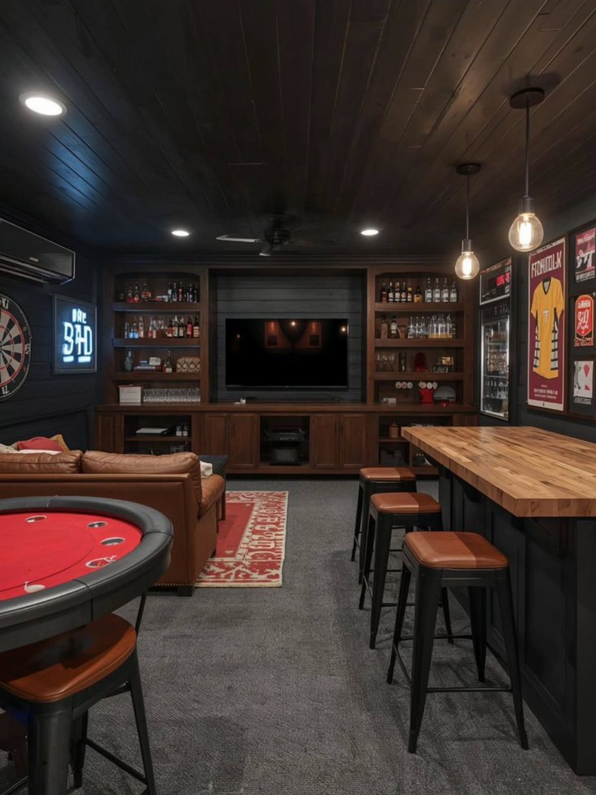 Wooden bar with leather stools in a dark man cave with entertainment center.