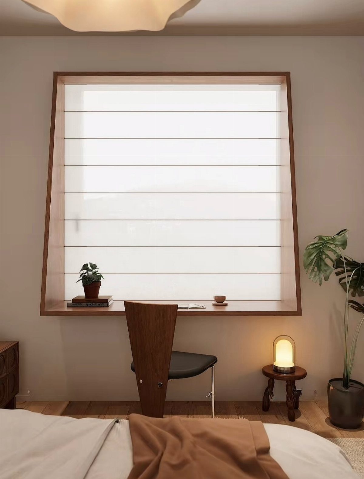 Wooden desk integrated into a window sill with a minimalist chair and plant.