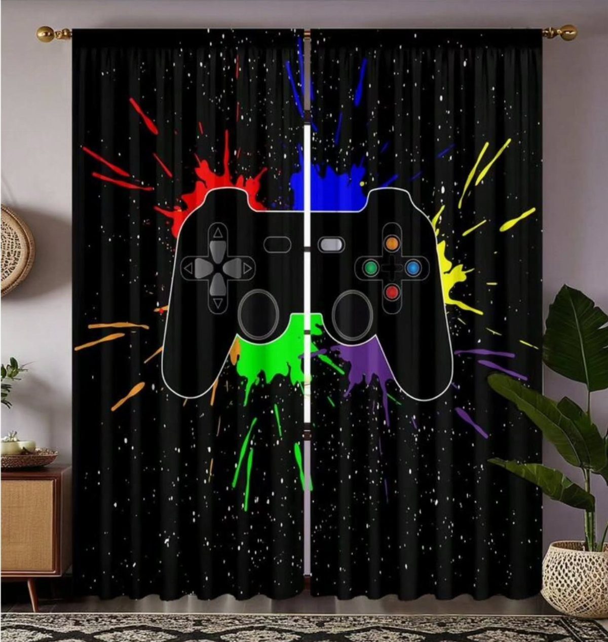 Black curtains with a colorful game controller graphic in a decorated room